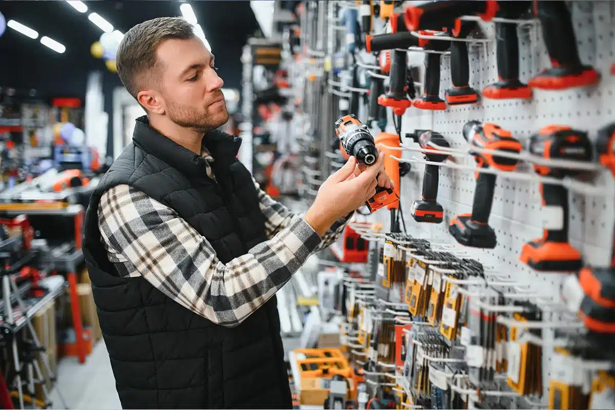 A man is shopping for the correct tools to start an HVAC job